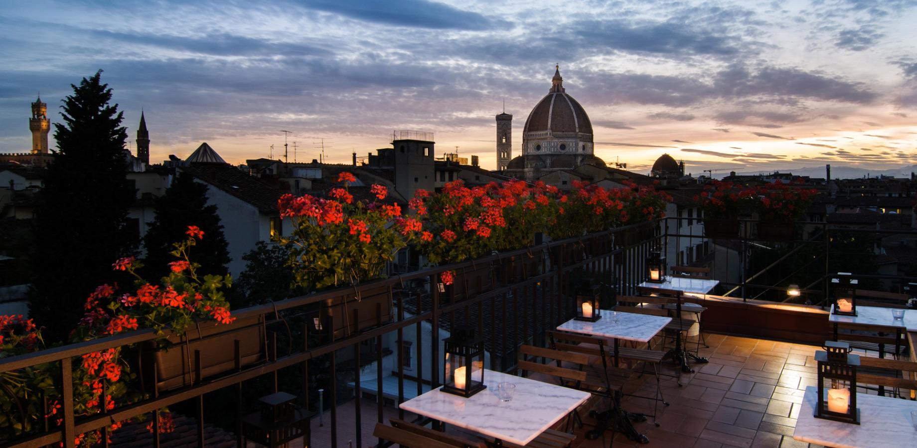 Panoramic terrace with cathedral view at sunset.