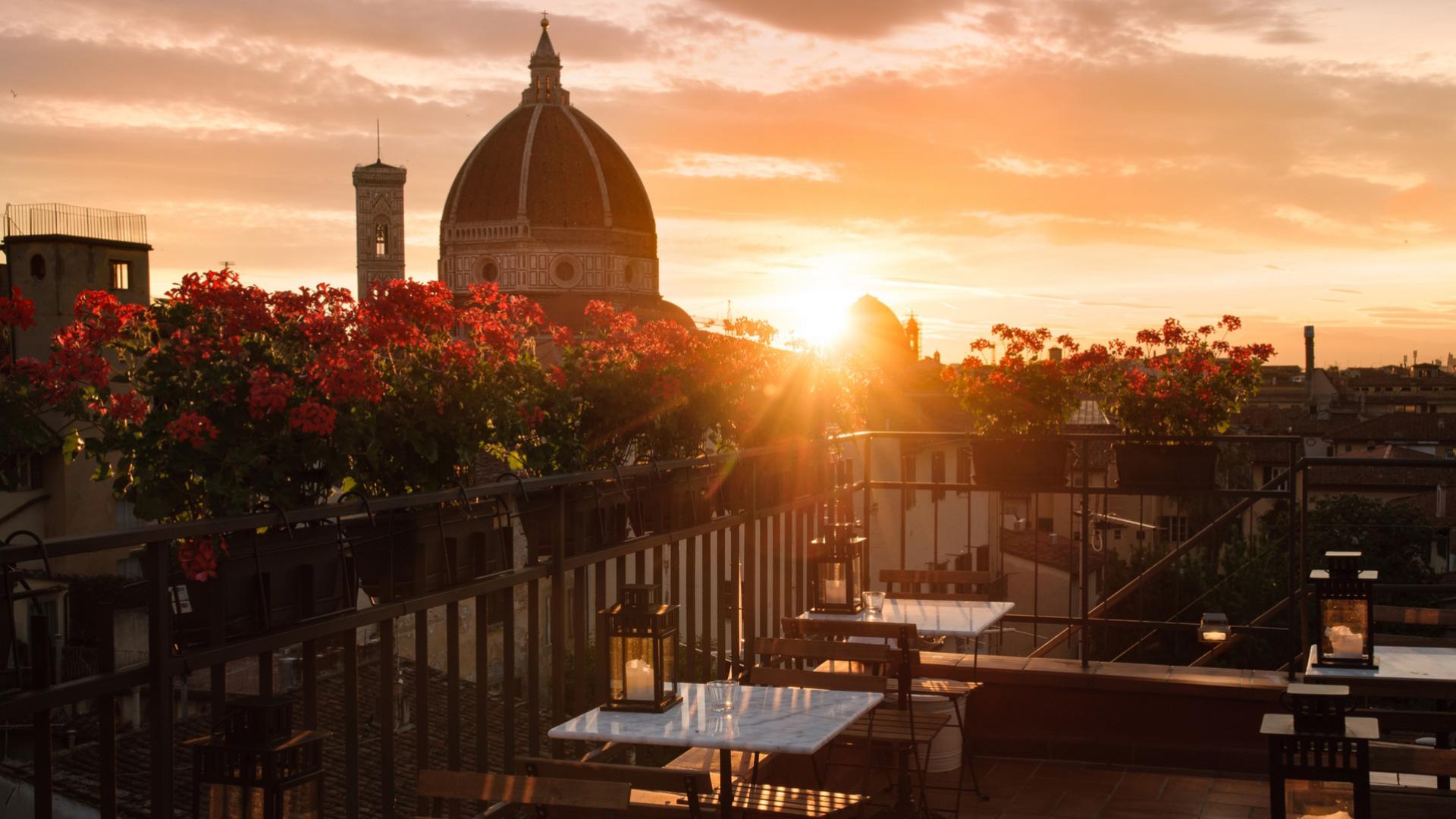 Terrace with a view of Florence's Duomo at sunset.